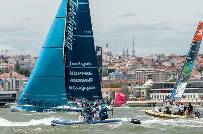 Team Telefonica, is surrounded by support and spectator boats, in the Oeiras In-Port Race in Lisbon © Paul Todd/Volvo Ocean Race http://www.volvooceanrace.com